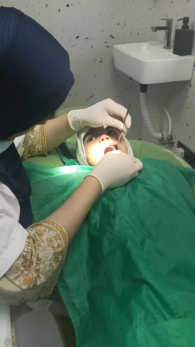 Specialist examining a patient at Saeed Dental Mumbra